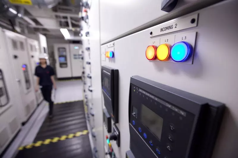 Control room with illuminated electrical panels